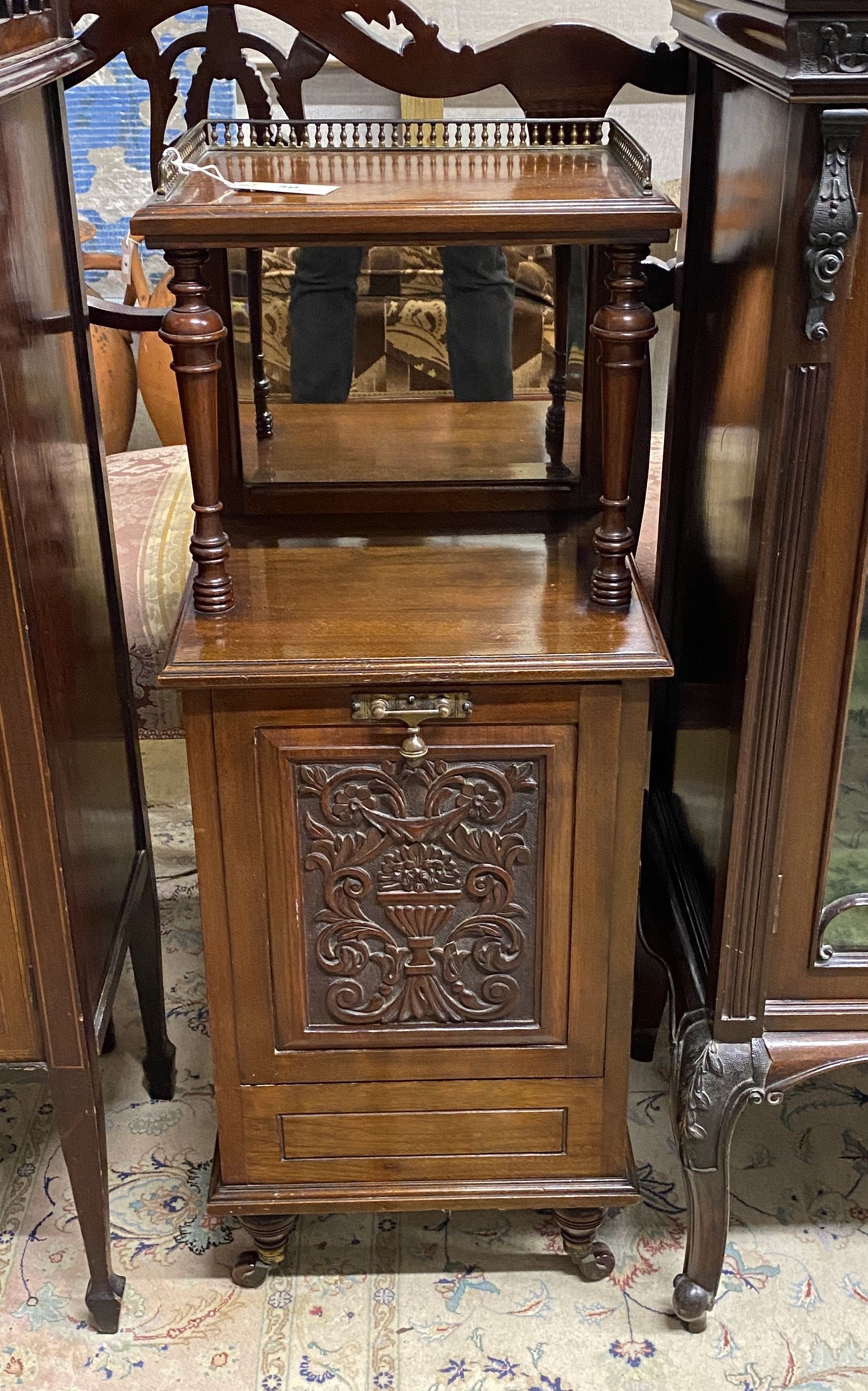 A Victorian carved walnut mirrored back coal purdonium, width 36cm, depth 35cm, height 96cm